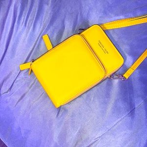 Yellow purse that you can put your phone in it to see